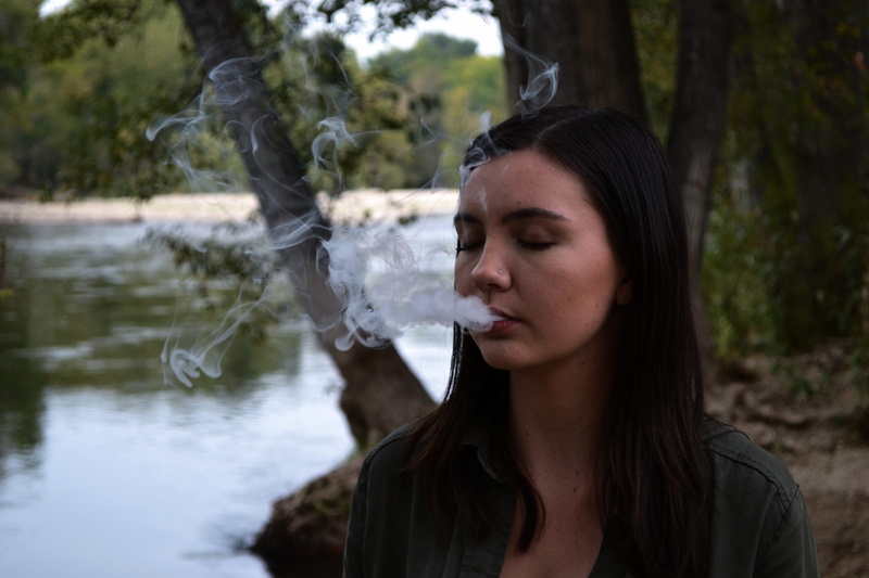 beautiful woman, young women, young adult, bad habit, looking, adult, coming, focus on foreground, headshot, day, one person, mouth, tree, real people