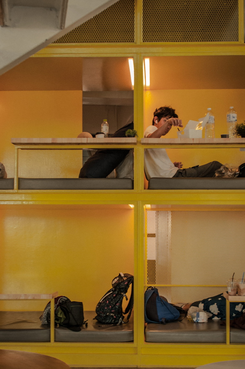 bed, lifestyles, mirror, human, table, women, room, hostel, interior design, real people, home interior, sitting, shelf, men, flooring, clothing, building