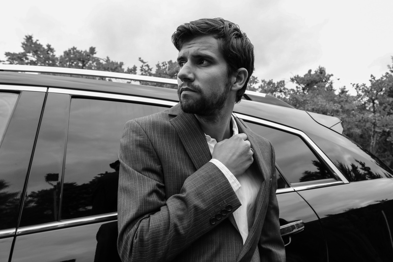 parking lot, attractive, mode of transportation, adult, business, men, shirt, real people, motor vehicle, black, stylish, outdoors, man in suit, person