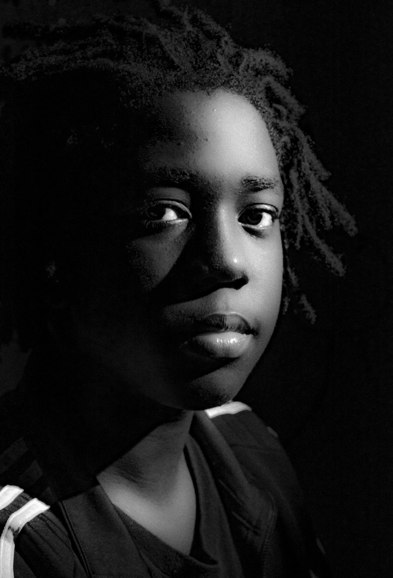 females, studio shot, childhood, 5K, low-key, contemplation, curly hair, real people, looking at camera, lifestyles, young adult, wadi lissa, portrait