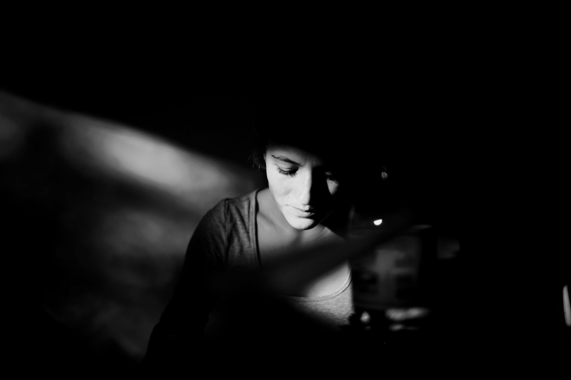 film noir style, indoors, young Adult, sensuality, woman, black background, loneliness, one woman only, top, neck, low Key, beautiful, one Person, gray