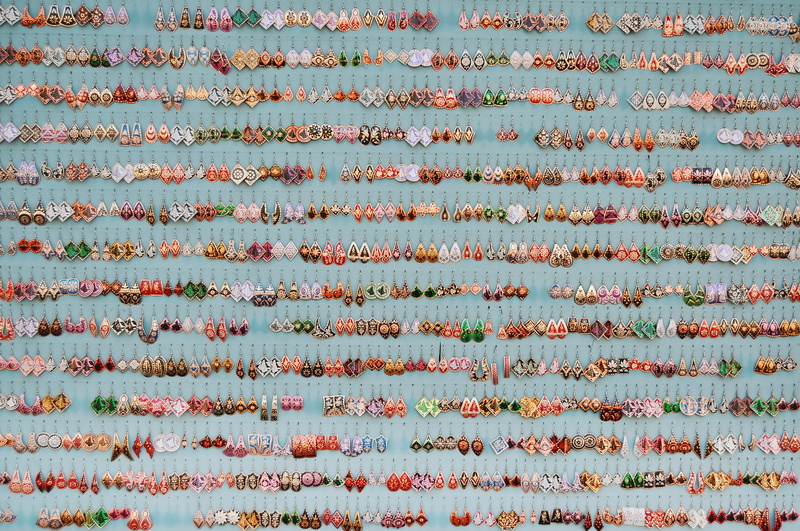 green, in a row, orange, background, print, indoors, plant part, leaf, high angle view, display, backgrounds, gold, hanging, row, pattern, assorted, white