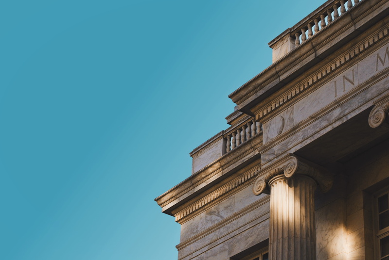 concrete, sky, city, blue, photo, courthouse, building exterior, angle, built structure, low, nature, sunlight, architectural column, clear sky, no people