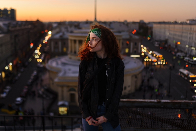 illuminated, urban, built structure, focus on foreground, warm clothing, depth of field, architecture, outdoors, standing, young women, leisure activity