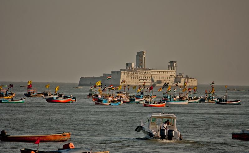 beach, boats, water, architecture, group of people, building exterior, mode of transportation, men, transportation, city, large group of people, crowd