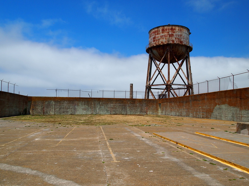 outdoors, blue, empty, united states, alcatraz island, road, jail, sky, cloud - sky, no people, direction, water tower - storage tank, san francisco, security