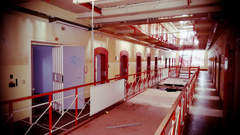 built structure, architecture, indoors, ceiling, seat, penitentiary, window, corridor, prison, chair, entrance, historically, sunlight, jail, arcade, absence