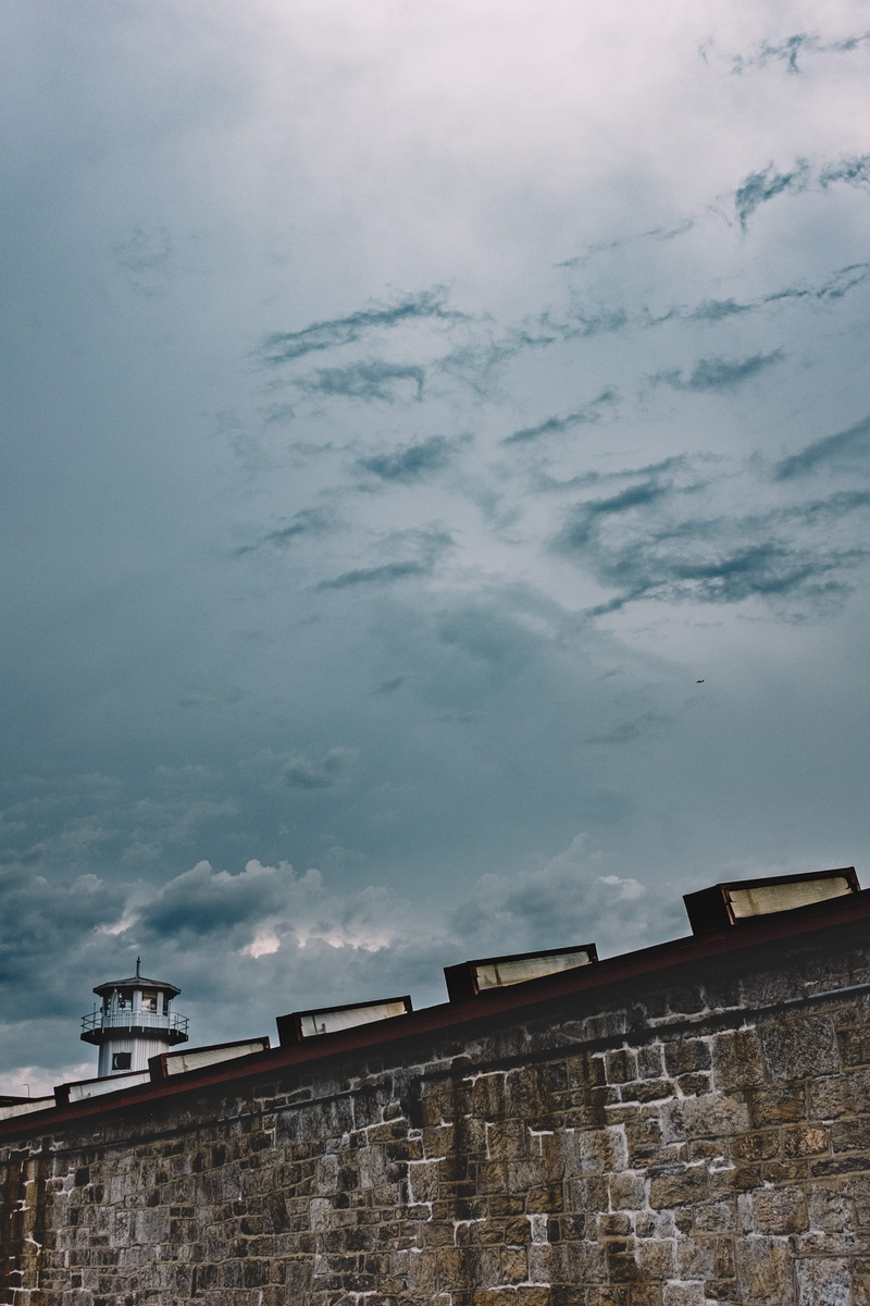dusk, nature, storm, outdoors, wall - building feature, residential district, beauty in nature, prison, cloud - sky, penitentiary, built structure, no people