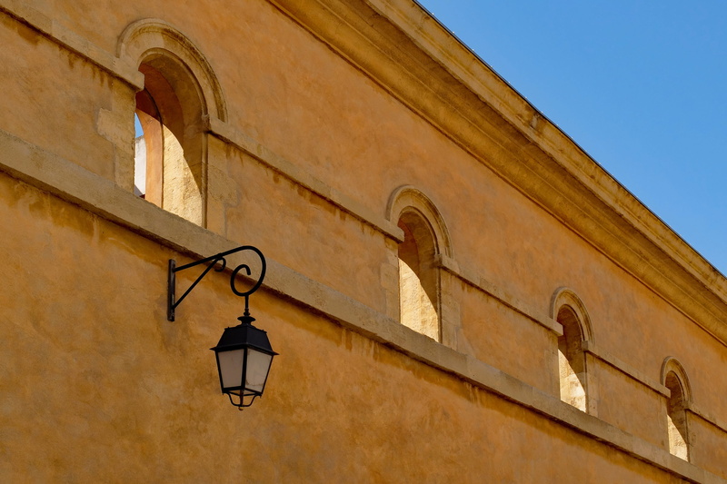 building, electric lamp, jail, religion, built structure, aix-en-provence, wall, france, arch, street, justice, house, day, clear sky, low angle view, history