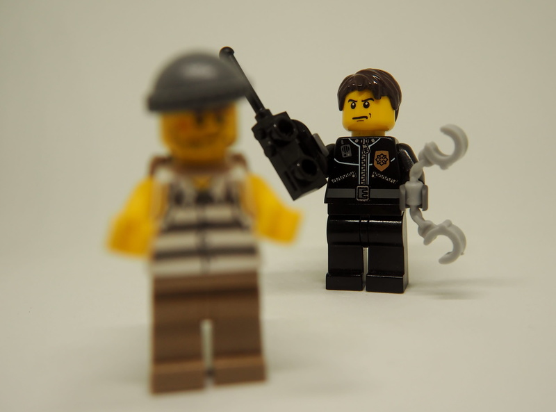 close-up, humor, male likeness, representation, toy, studio shot, men, follow, fun, gun, robot, weapon, selective focus, arrest, theft, wood - material