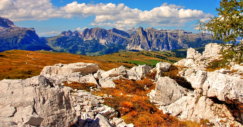 beauty in nature, rubble field, clouds, hiking, valley, alpine panorama, solid, outdoors, mountain, tourism, plant, mountain range, rocky, no people, sky