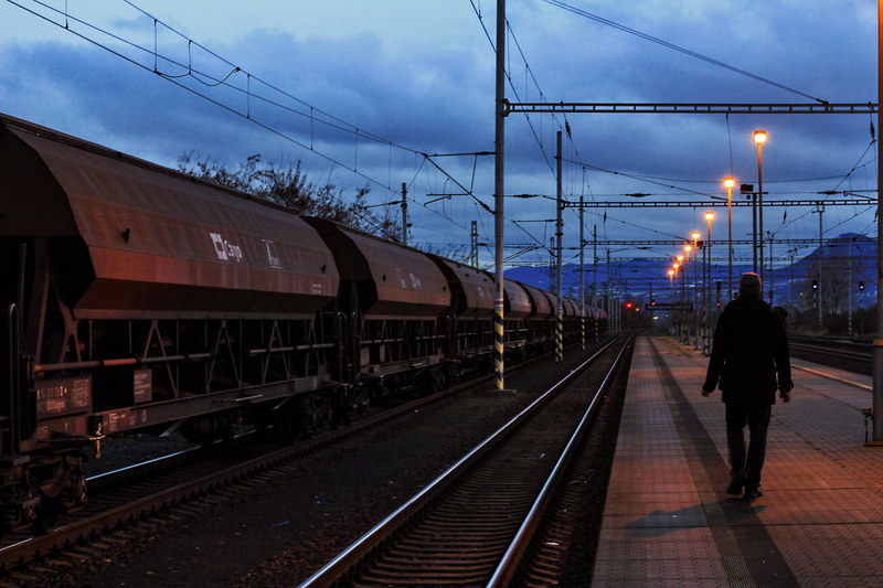 railway line, lights, one person, arrival, track, train - vehicle, dusk, railroad station, train, steel, pathways, sunset, night, mode of transportation