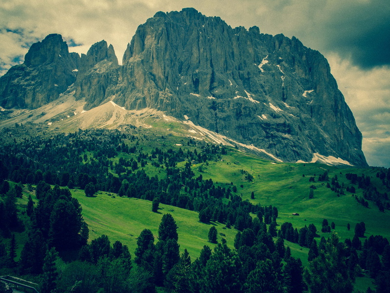 land, plant, sun, outdoors, cloud - sky, sella, tranquil scene, idyllic, sky, tranquility, environment, rock, day, range, green color, nature, dolomites