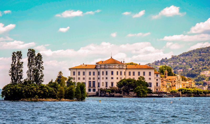 tourism, courthouse, water, plant, blue sky, mountain, city, waterfront, island, villa, cloud, summer, nature, river, tree, building exterior, built structure
