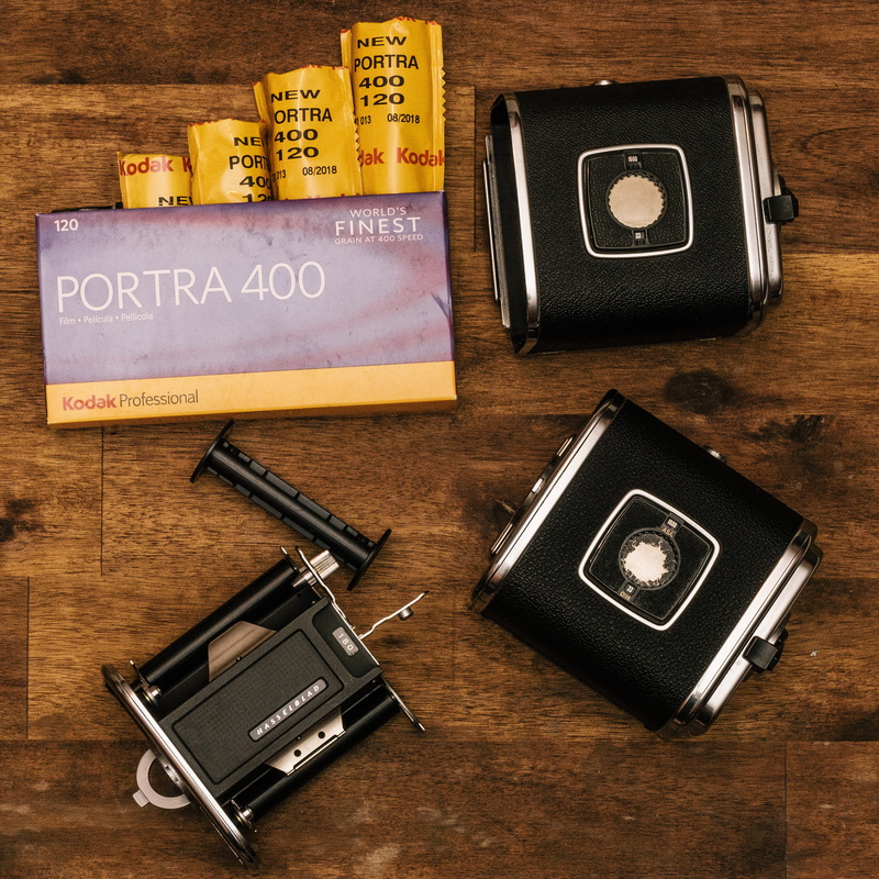 camera, plastic, technology, table, close-up, old-fashioned, shutter, choice, nostalgia, black, wood, storage, analog, text, directly above, photography themes