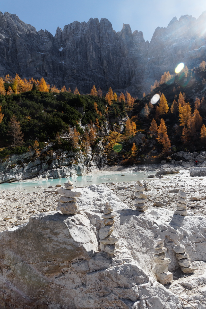 tree, beauty in nature, flowing water, water, rock - object, non-urban scene, autumn, lake, flowing, balancing, lagoon, nature, woodland, plant, formation