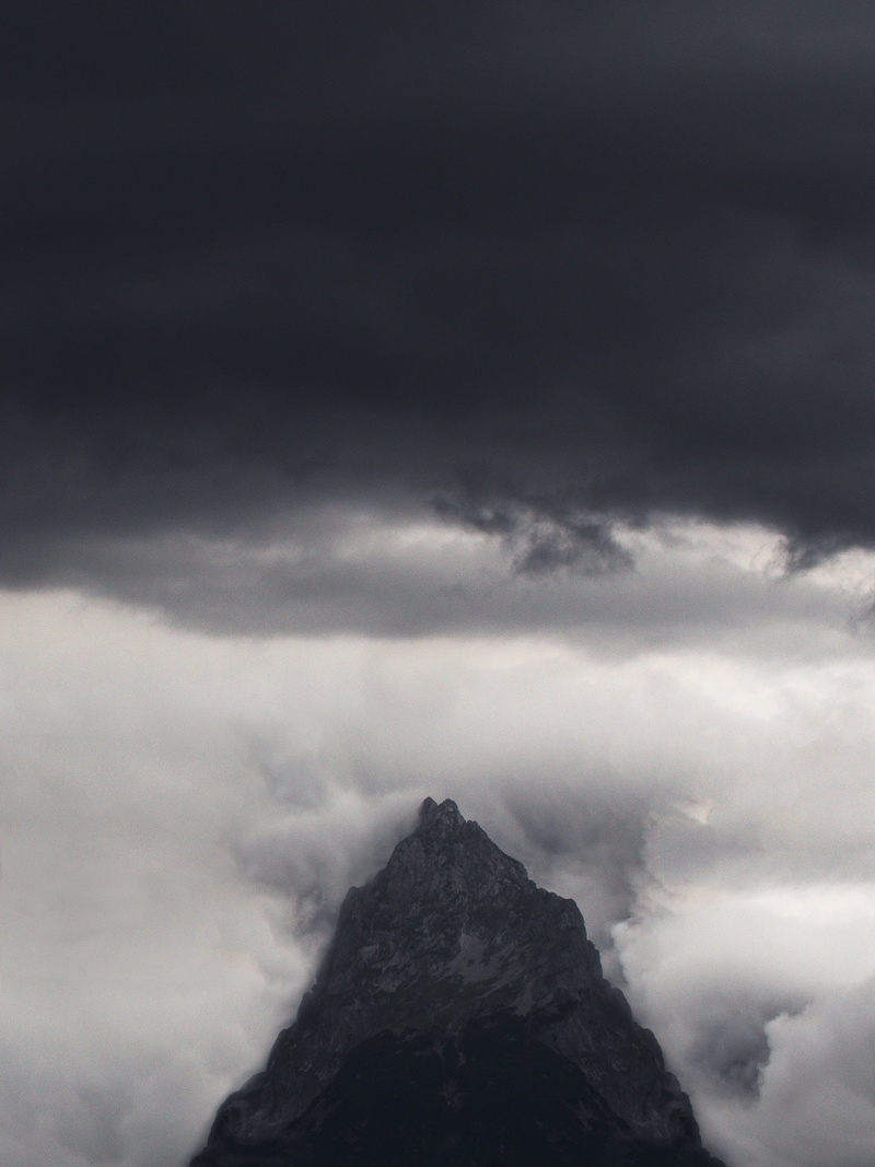 jagged, nature, summit, tranquil scene, outdoors, sky, day, rock, environment, low angle view, solid, mountain, storm, black, beauty in nature, no people