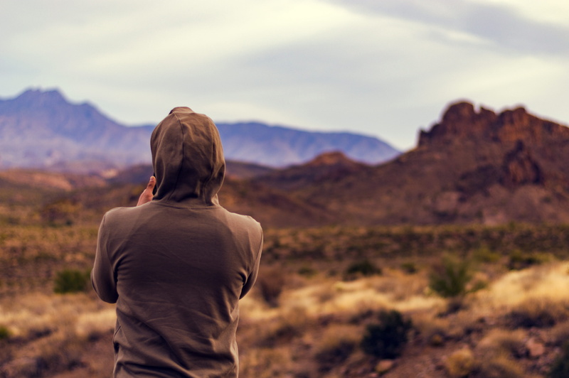 environment, looking at view, outdoors, leisure activity, mountain, lifestyles, non-urban scene, focus on foreground, scenics - nature, hairstyle, casual clothing