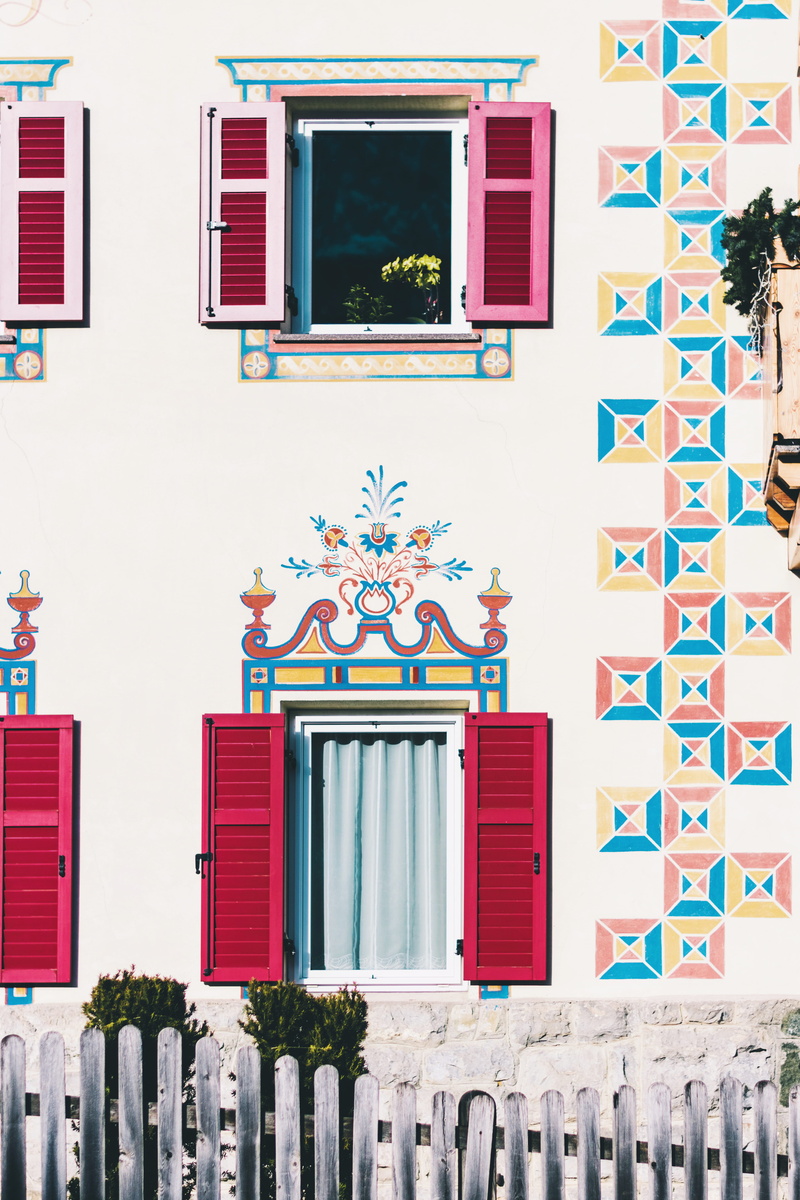 curtain, low angle view, windows, shutter, red, residential district, door, wall - building feature, mountain house, decoration, built structure, city