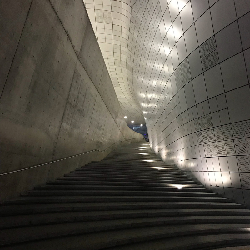 perspective, tunnel, illuminated, 2K, railing, direction, pattern, staircase, ceiling, indoors, underground walkway, built structure, light at the end of the tunnel