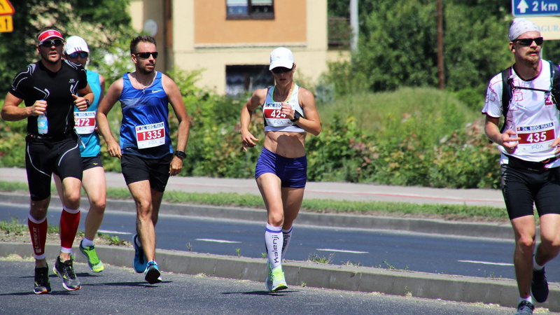 front view, at the court of, active, runs, cross country skier, full length, man, race, young men, competition, marathon, street, leisure activity, young adult