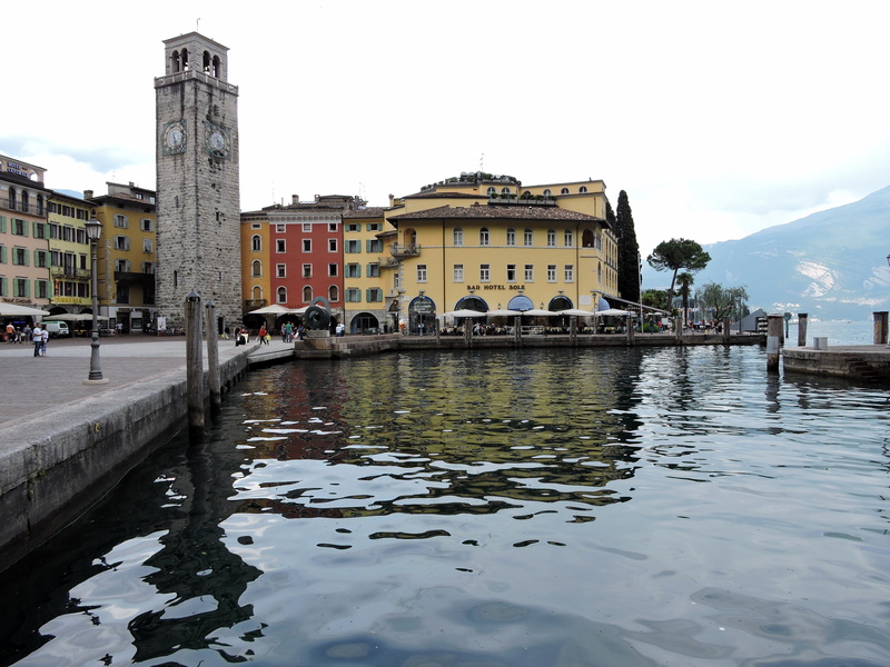 city, built structure, sky, place of worship, architecture, transportation, garda, canal, incidental people, building exterior, the past, tourism, travel destinations