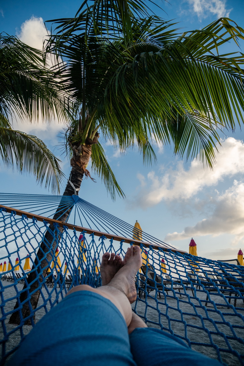 one person, paradise, island, nevis, sky, tropical climate, palm tree, cloud - sky, low section, personal perspective, human foot, tree, sleep, real people