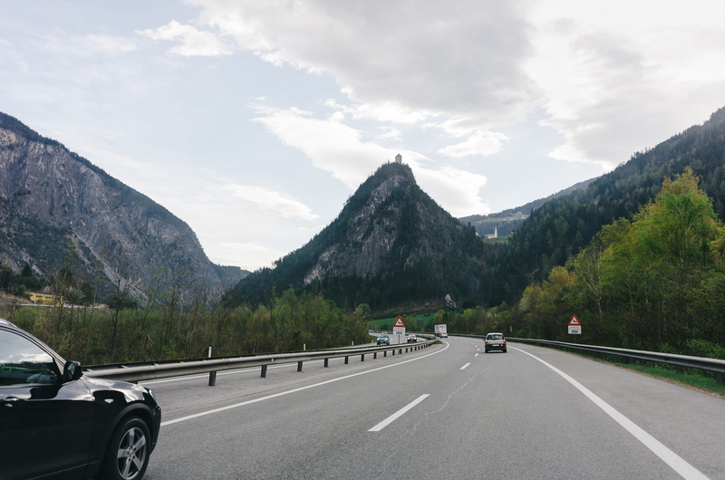motor vehicle, road marking, clouds, switzerland, nature, land vehicle, europe, street, transport, sign, curve, view, direction, asphalt, 2K, motion, no people