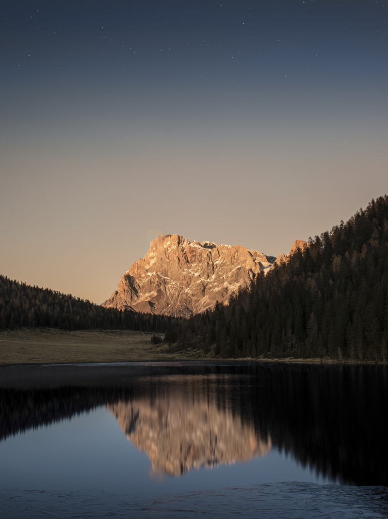 waterfront, scenics - nature, tree, tranquility, body, night, sunset, astronomy, sky, beauty in nature, dusk, mountain range, mountain, outdoors, ice, dawn