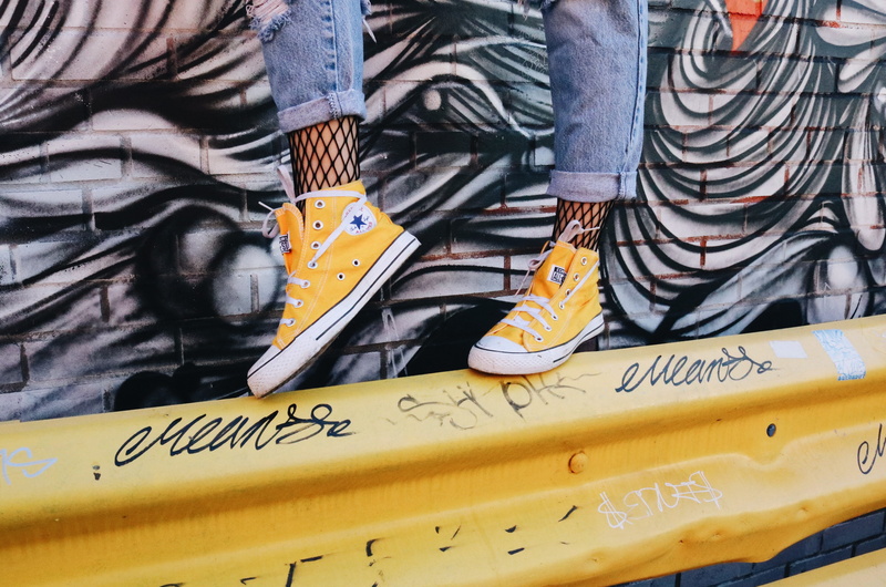 real people, legs, shoe, leisure activity, lifestyles, unrecognizable person, shoes, yellow, outdoors, converse, barricade, communication, 5K, jeans, feet