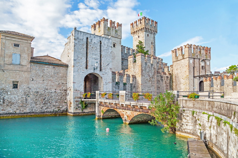 building exterior, arch bridge, bridge, outdoors, Sirmione, cityscape, view, water, panorama, nature, built structure, history, arch, day, connection, sky