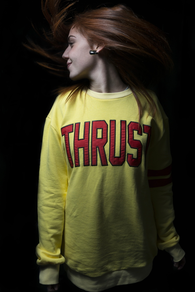 front view, young adult, beautiful woman, one person, italy, black background, sony, teenager, waist up, giallo, standing, text, casual clothing, hairstyle
