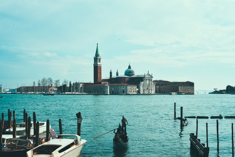mode of transportation, architecture, gondola, cloud - sky, sky, wooden post, person, italy, nautical vessel, venice, place of worship, religion, distance