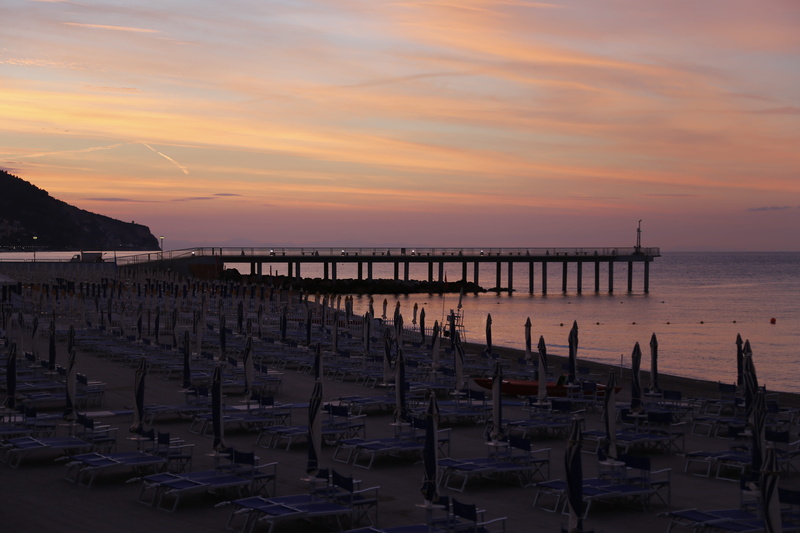 water, reflection, idyllic, tranquility, orange color, sky, no people, nature, cloud - sky, architecture, scenics - nature, wooden post, outdoors, pietra ligure