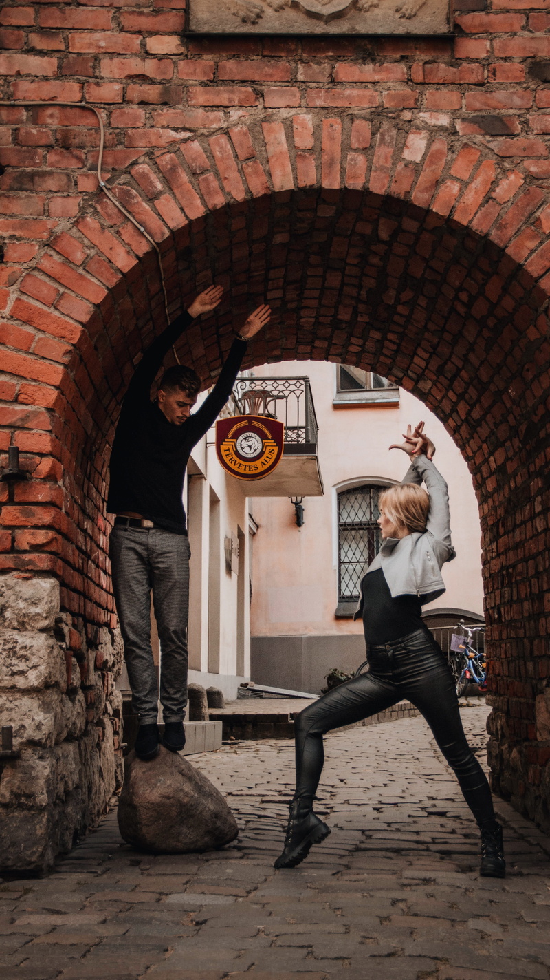 building exterior, passion, people, alcove, partner, riga, brick, latvia, lifestyles, casual clothing, pub, real people, beer, brewery, young adult, dance move