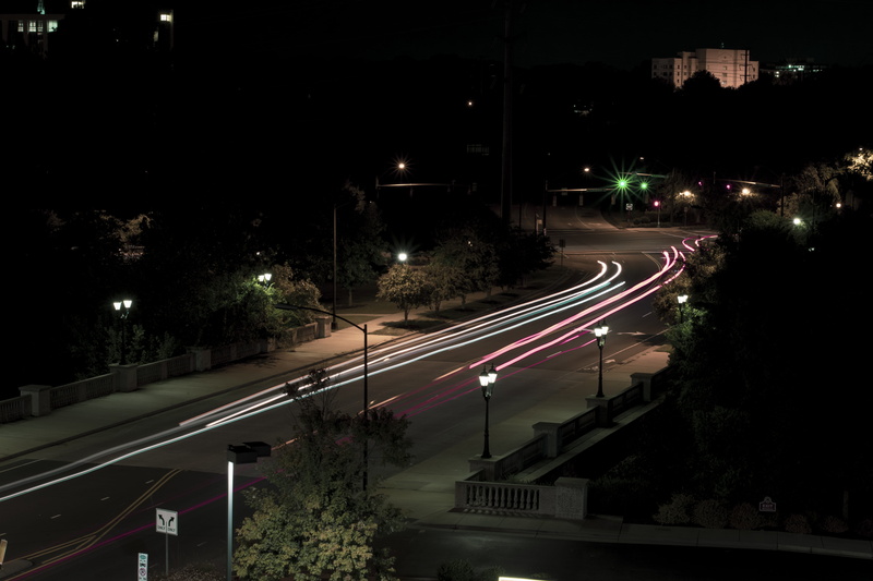 building exterior, metropolis, night life, asphalt, night, city, transportation, building, high angle view, motion, lighting, time, zebra crossing, vehicle light
