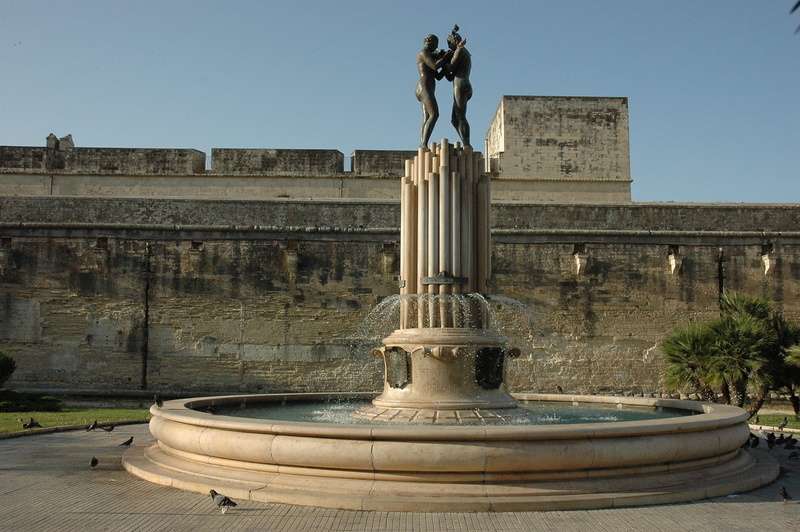 sky, water, clear sky, art and craft, building exterior, history, statue, architectural column, outdoors, fountain, travel destinations, representation