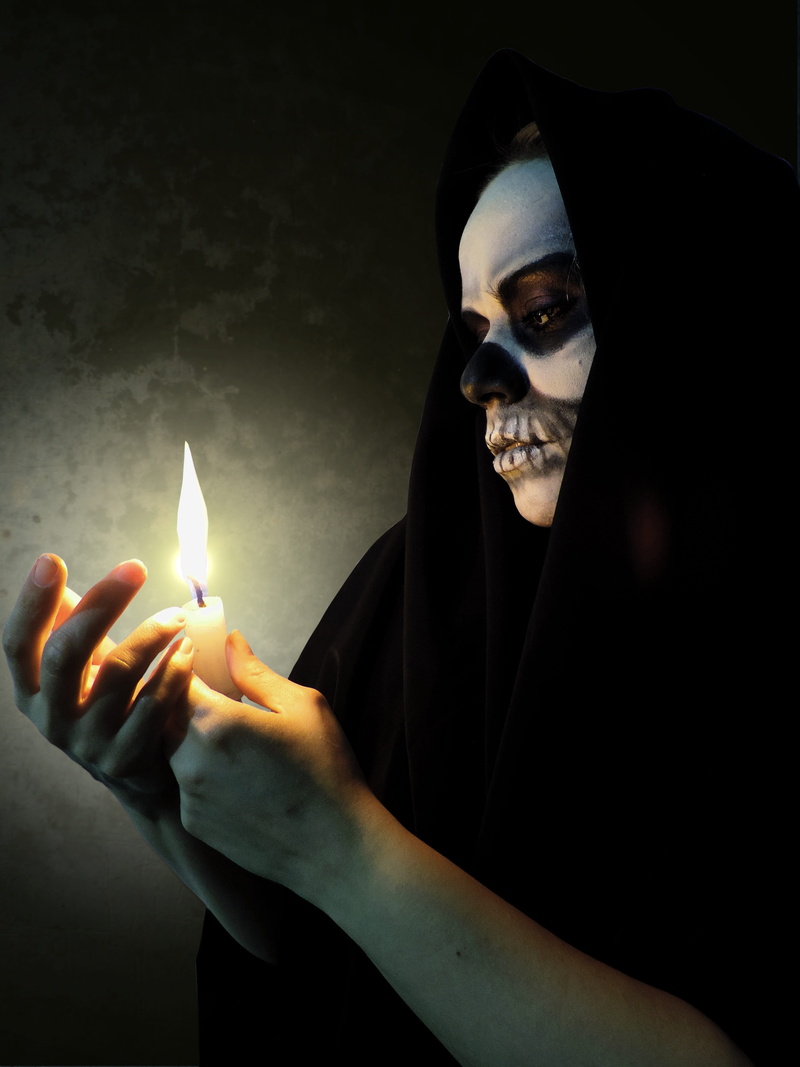 lifestyles, skull, burning, looking at camera, real people, portrait, face, popular festivals, halloween, holding, glowing, fire, calaca, young adult, indoors