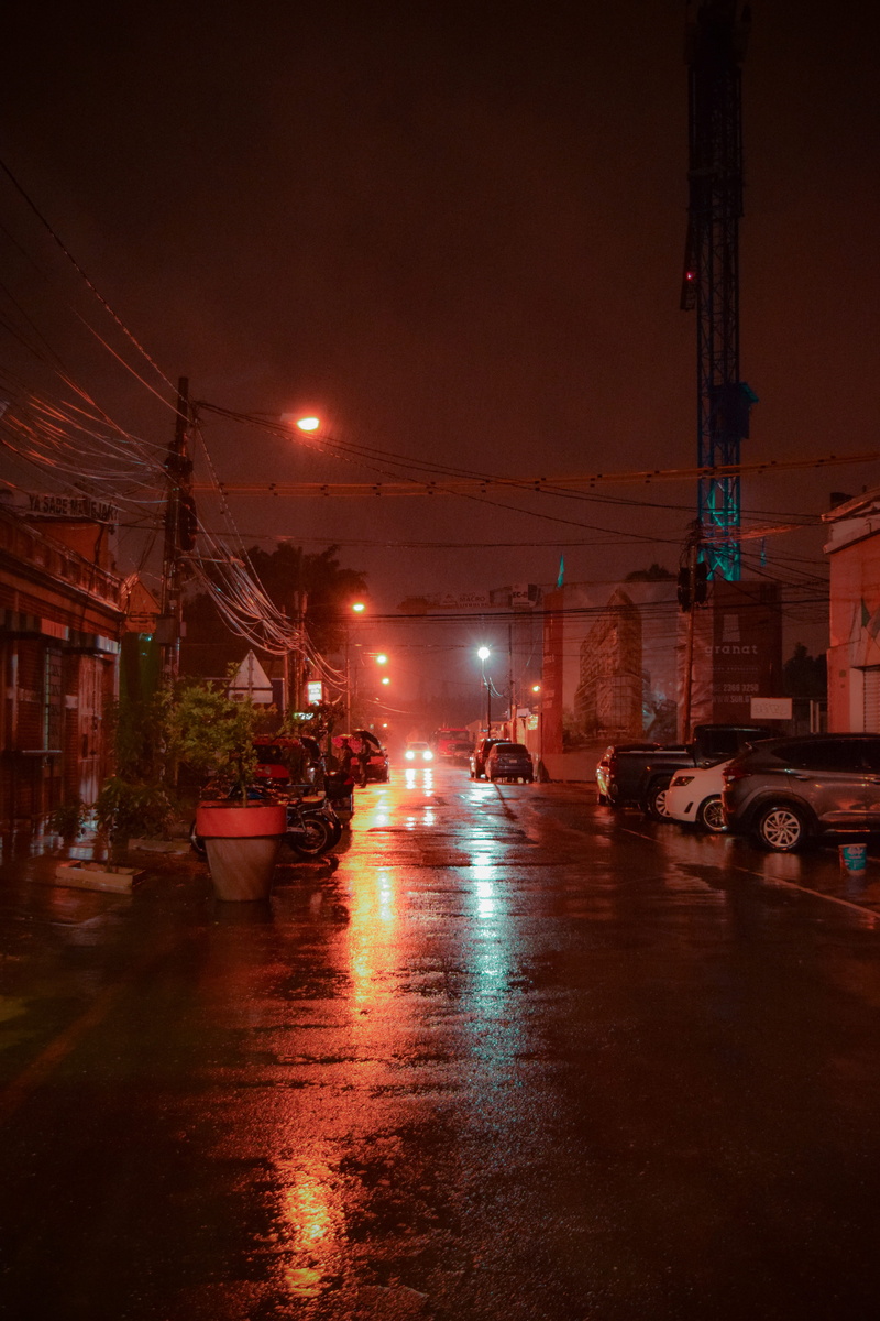 car, wet, street, night, mode of transportation, sky, nature, building exterior, built structure, architecture, transportation, land vehicle, road, city street