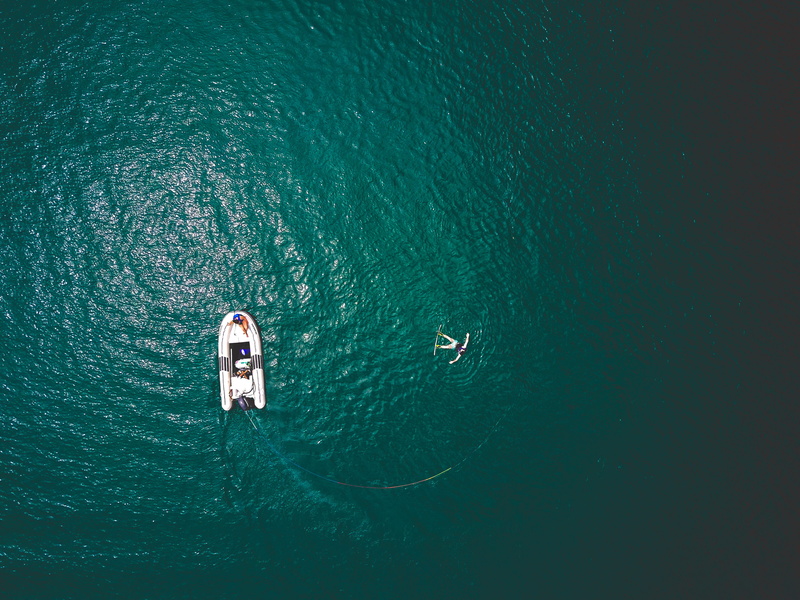 vessel, one person, watercraft, boat, transportation, sport, adventure, sailboat, lagoon, beauty in nature, real people, vehicle, vacations, sports, weekend activities