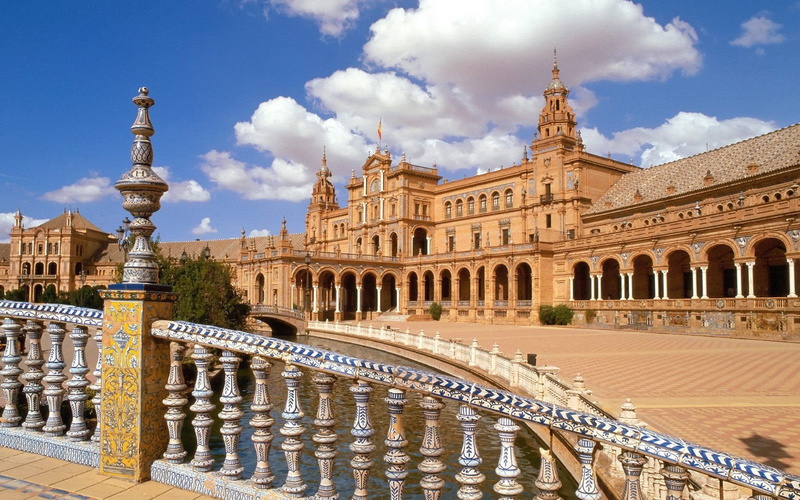 tower, city, outdoors, sky, famous Place, day, town Square, plaza De Espana - Seville, water, travel, building Exterior, brown, no people, national Landmark