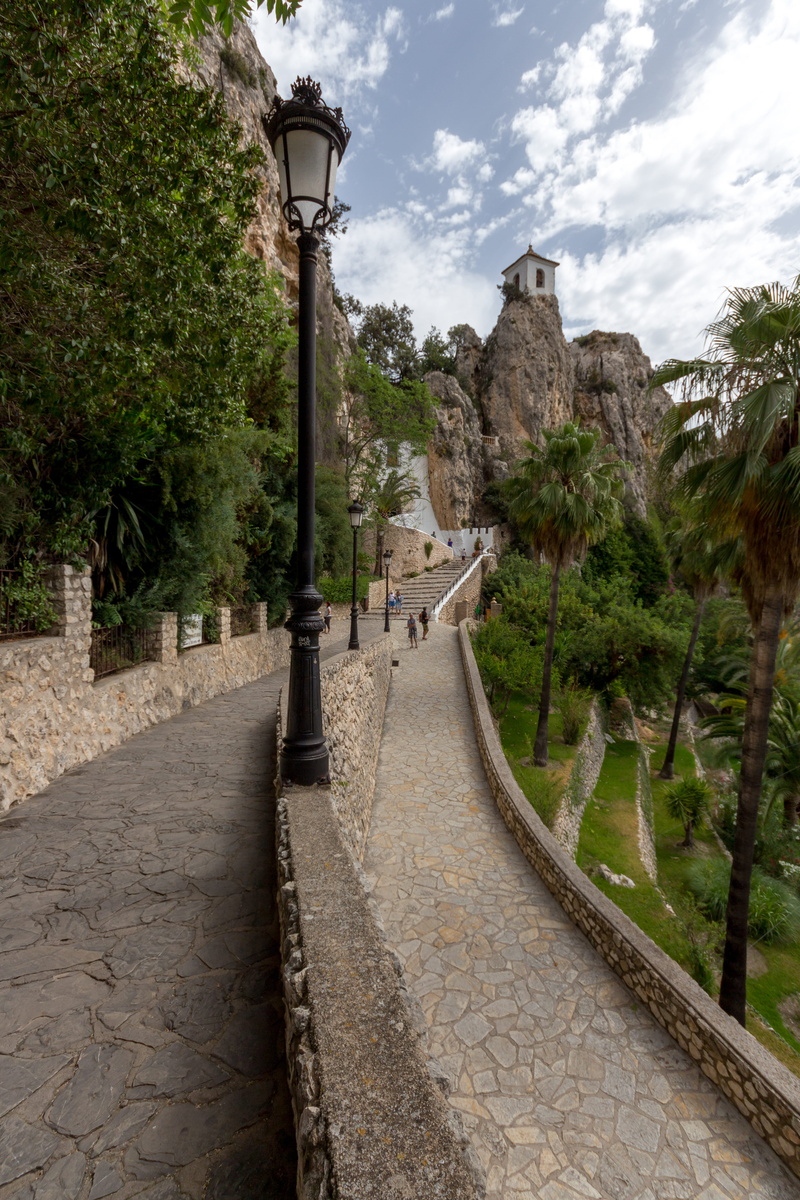 path, architecture, city, street, direction, transportation, nature, footpath, valencia, summer, building exterior, day, alicante, plant, tree, sky, spain