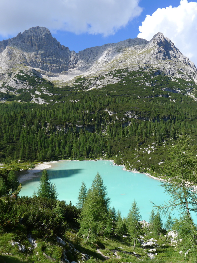mountain, turquoise water, mountain peak, outdoors, no people, non-urban scene, tranquility, sky, nature, formation, beauty in nature, reflection, growth