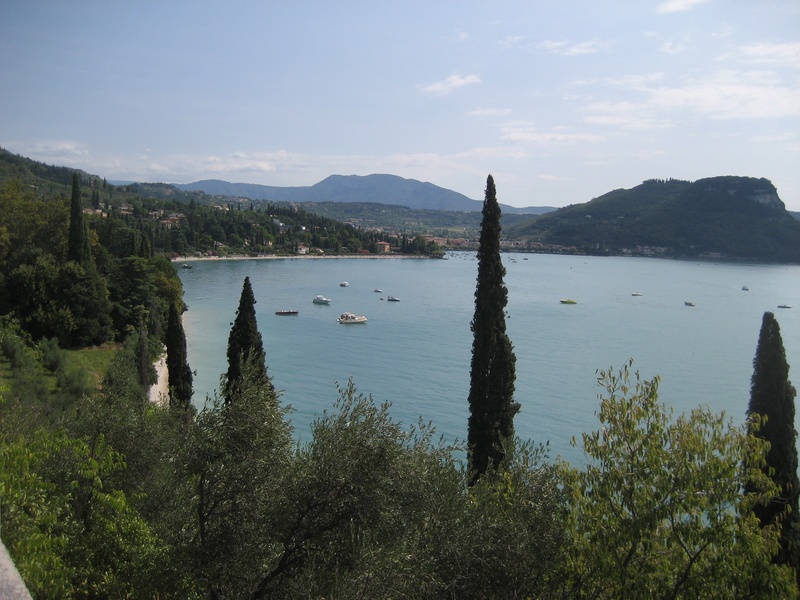 growth, idyllic, italy, water, sky, holiday, outdoors, tree, garda, mountain range, beauty in nature, lago di garda, plant, mountain, sailboat, scenics - nature