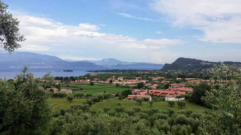 beauty in nature, building, no people, landscape, scenics - nature, italy, rural scene, nature, outdoors, view, lake, lago di garda, tree, house, mountains