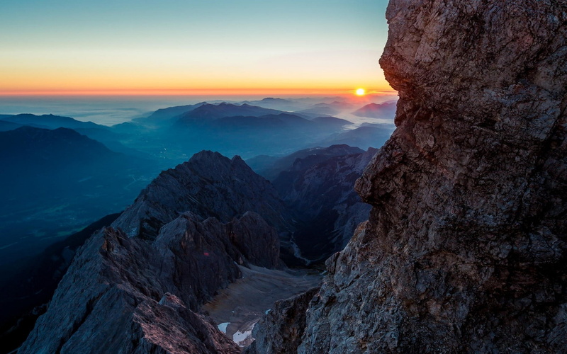 blue, beauty in nature, mountain peak, cliff, landscape, rock - object, rock, sunset, idyllic, sunlight, formation, scenics - nature, clear sky, no people