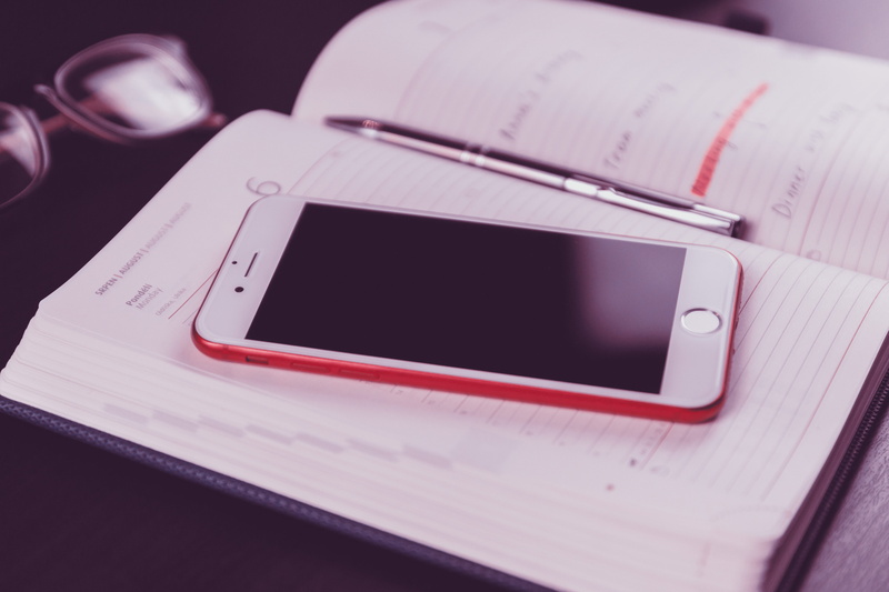high angle view, close-up, eyewear, black, table, desk, white, pen, connection, page, book, notes, wireless technology, still life, indoors, iphone, mobile