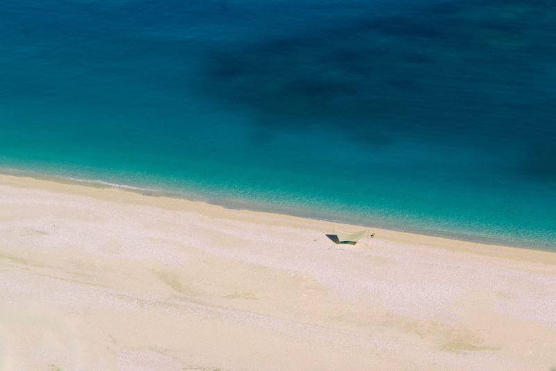 tranquil scene, one person, tranquility, turquoise, bay, unrecognizable person, land, azure, shore, sea, cephalonia, vacations, sun, sand, sunny, water