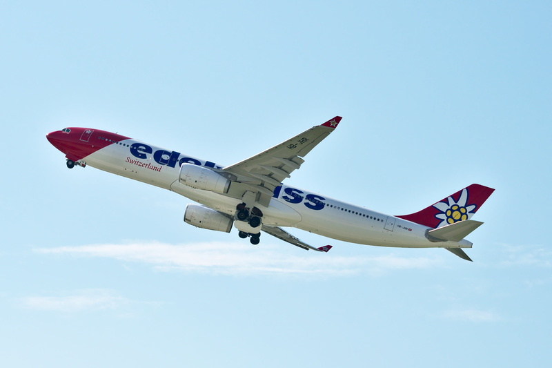 side view, commercial airplane, sky, clear sky, edelweiss, single object, outdoors, airbus a330, airport zurich, arrival, no people, mode of transportation