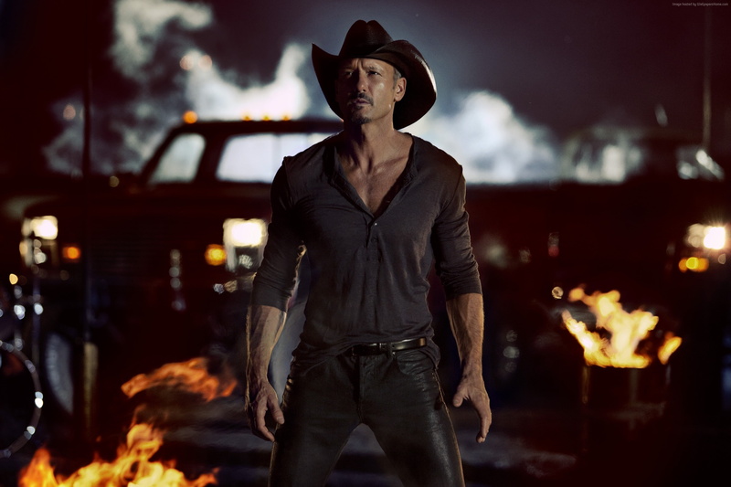 three quarter length, one person, singer, focus on foreground, front view, night, country, campfire, clothing, fire - natural phenomenon, young men, Tim McGraw